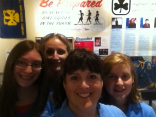 Casandra Dievert, Lynn Hooper, me and Samantha Oldale at the MacBride Museum of Yukon History, in front of a Girl Guiding exhibit.